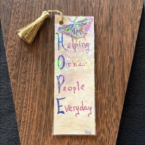 Handcrafted 
Bookmark with Gold Tassel 
‘Helping Other People Everyday'